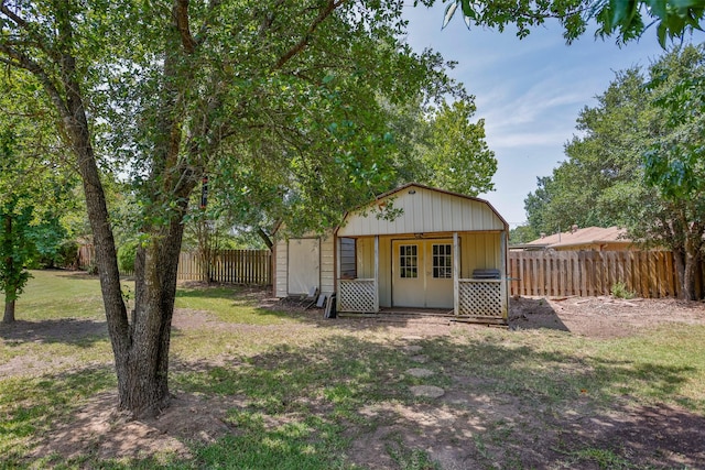 view of outbuilding featuring a yard