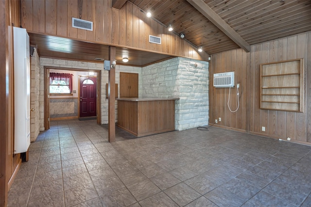 kitchen with high vaulted ceiling, an AC wall unit, wooden walls, and wood ceiling