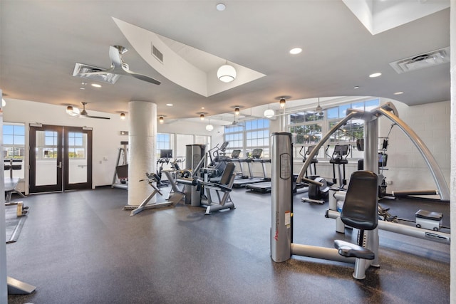 gym with a wealth of natural light and ceiling fan