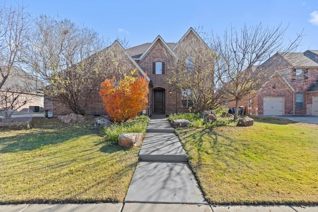 view of front of home with a front lawn and a garage