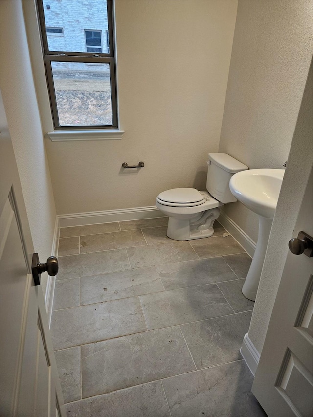 bathroom featuring sink and toilet