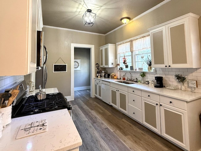 kitchen featuring dishwasher, gas stove, white cabinets, and sink