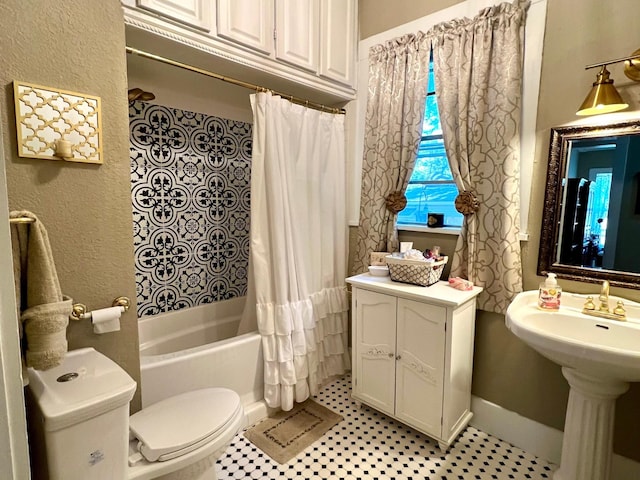 bathroom with tile patterned flooring, shower / bathtub combination with curtain, and toilet