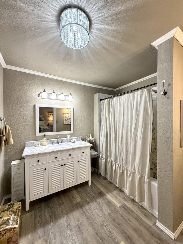 bathroom with shower / bathtub combination with curtain, crown molding, wood-type flooring, and a textured ceiling