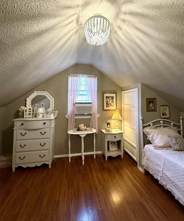 bedroom with dark hardwood / wood-style flooring, cooling unit, vaulted ceiling, and a textured ceiling