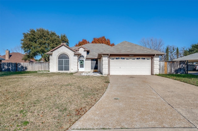 single story home with a garage and a front lawn