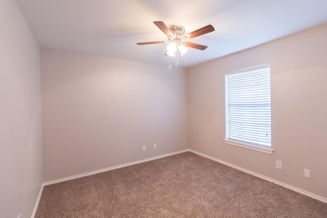 spare room with ceiling fan and carpet floors