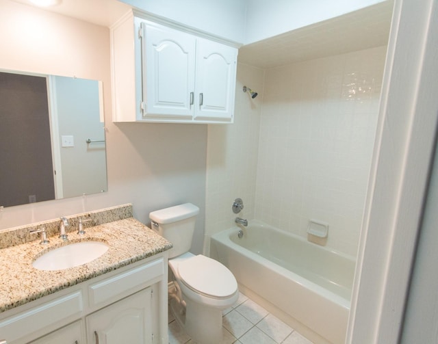 full bathroom featuring tile patterned floors, vanity, tiled shower / bath combo, and toilet