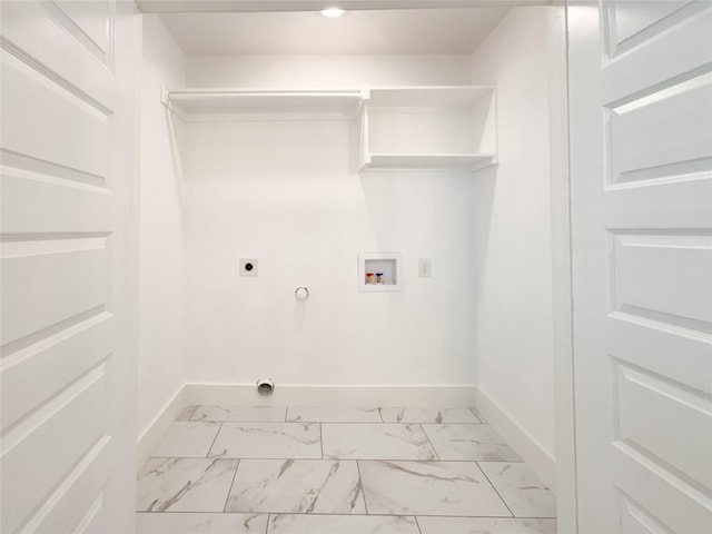 609 E 14th Ave, Corsicana, TX 75110 - laundry room with hookup for an electric dryer, gas dryer hookup, light marble finish flooring, baseboards, and washer hookup