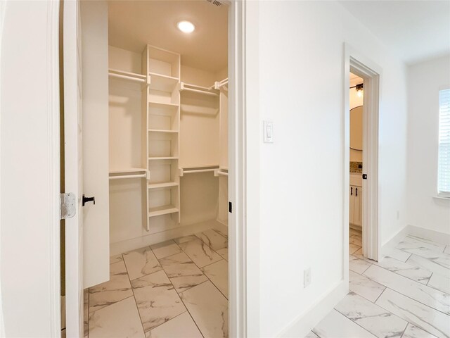 609 E 14th Ave, Corsicana, TX 75110 - walk in closet featuring marble look tile flooring