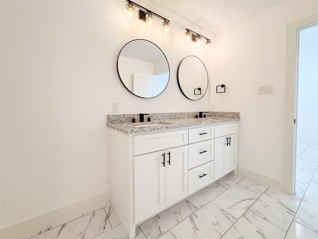 609 E 14th Ave, Corsicana, TX 75110 - full bath with marble look tile flooring, baseboards, and double vanity