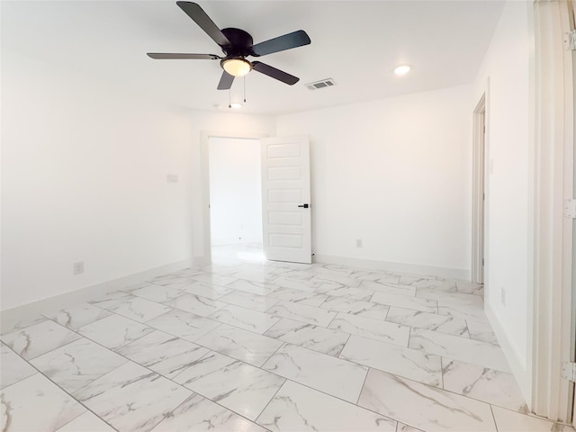 609 E 14th Ave, Corsicana, TX 75110 - empty room featuring baseboards, recessed lighting, ceiling fan, and light marble finish floors