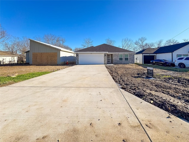 ranch-style house featuring a garage