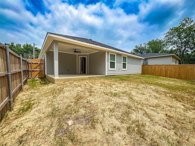 609 E 14th Ave, Corsicana, TX 75110 - rear view of house featuring a ceiling fan, a patio, and a gate