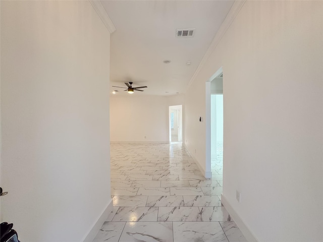 609 E 14th Ave, Corsicana, TX 75110 - hallway featuring ornamental molding, marble finish flooring, and baseboards