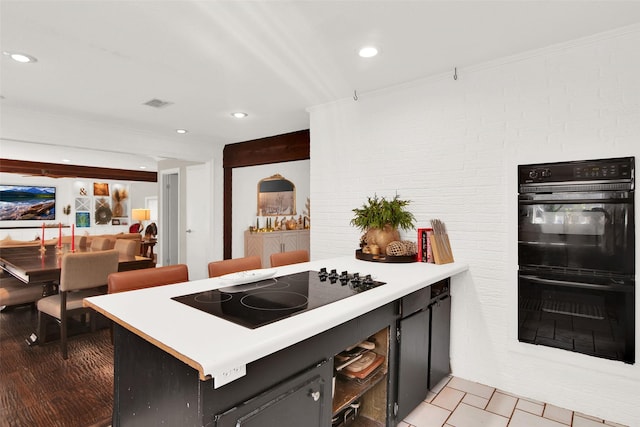 kitchen featuring kitchen peninsula and black appliances