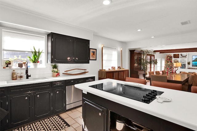 kitchen with black electric cooktop, a healthy amount of sunlight, sink, and stainless steel dishwasher