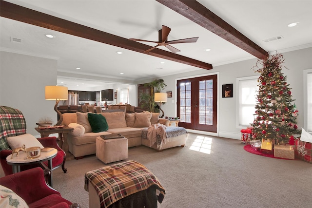 living room featuring carpet flooring, ceiling fan, beam ceiling, and ornamental molding