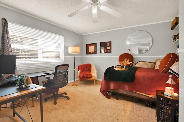 bedroom featuring carpet flooring, ceiling fan, crown molding, and a textured ceiling