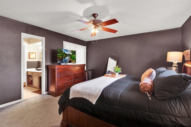 carpeted bedroom featuring ensuite bathroom and ceiling fan