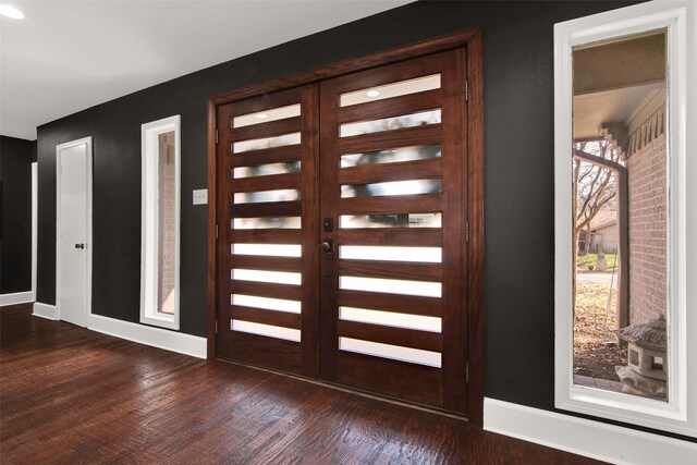 doorway to outside featuring dark wood-type flooring and french doors