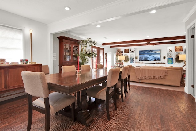 dining room featuring beam ceiling, dark hardwood / wood-style flooring, ornamental molding, and a wealth of natural light