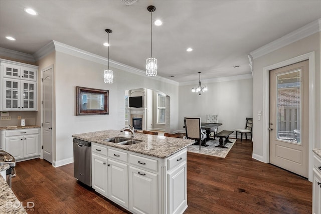 kitchen featuring white cabinetry, sink, pendant lighting, and dishwasher