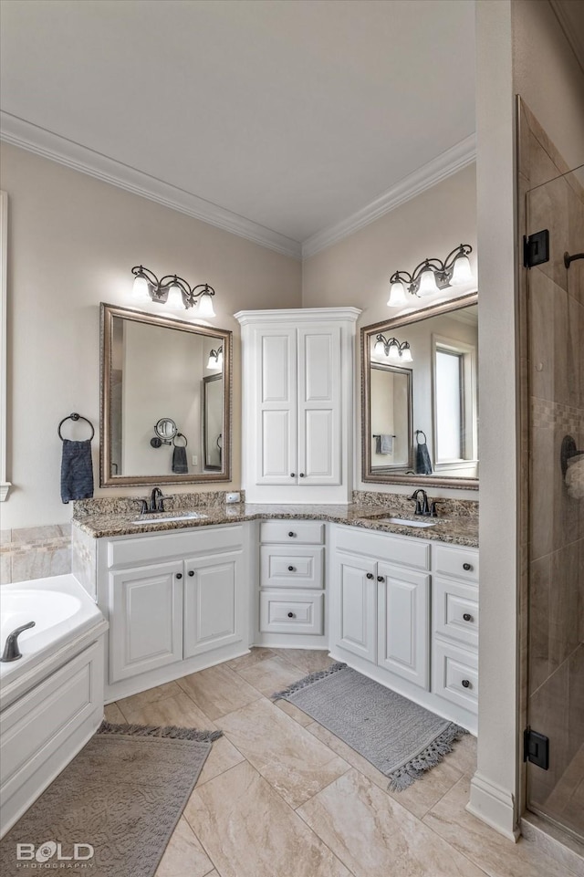 bathroom featuring vanity, crown molding, and shower with separate bathtub