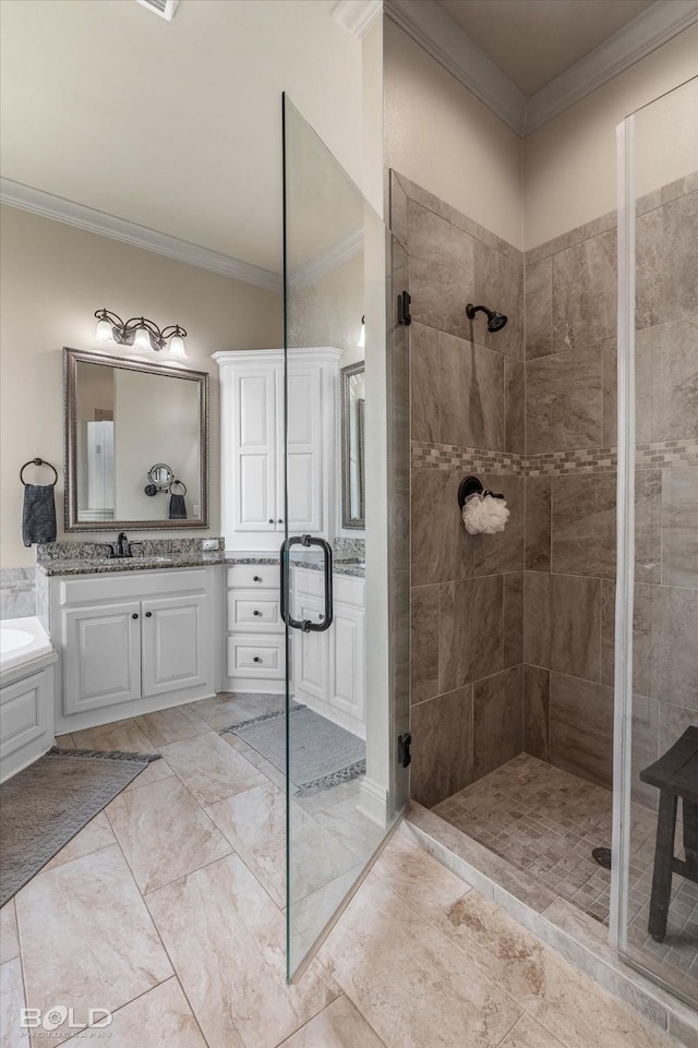 bathroom with ornamental molding, an enclosed shower, and vanity