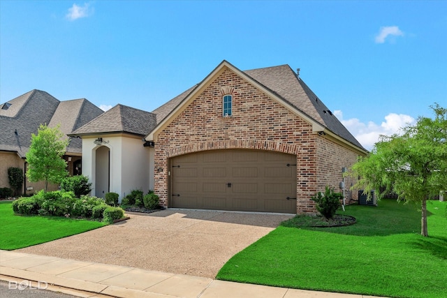 french country inspired facade featuring a front yard and a garage