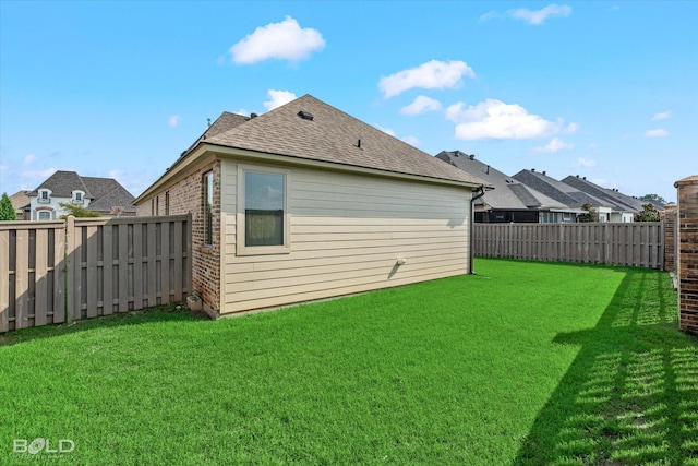 rear view of property featuring a yard