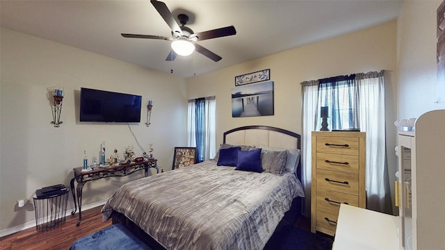 bedroom featuring ceiling fan and dark wood-type flooring