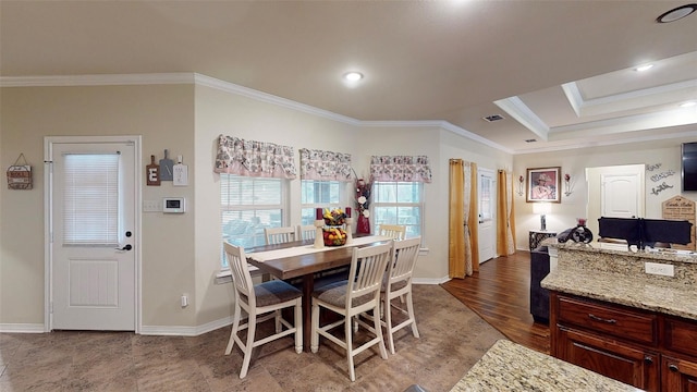 dining space featuring crown molding and hardwood / wood-style floors