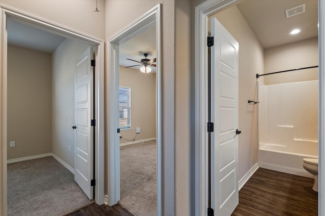 corridor with dark wood-type flooring