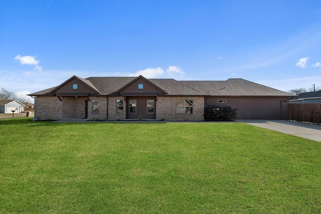 ranch-style house featuring a front lawn and a garage