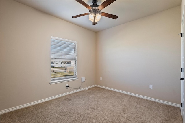 unfurnished room with ceiling fan and light carpet