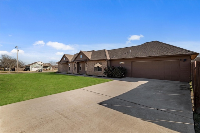 view of front facade with a garage and a front lawn