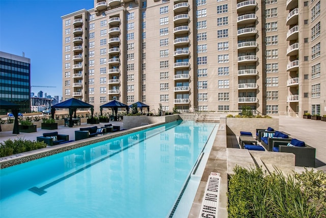 view of swimming pool featuring a gazebo and a patio area