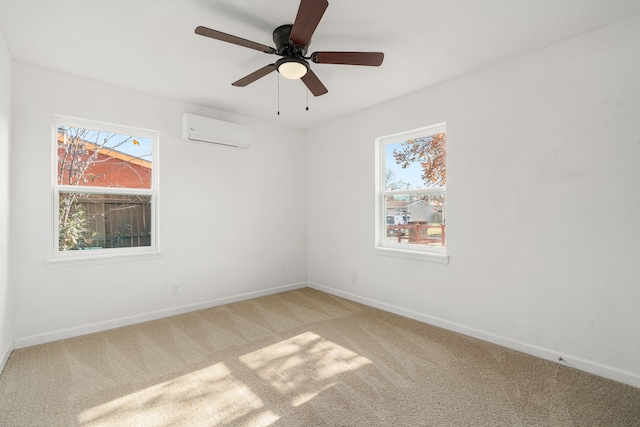 unfurnished room featuring ceiling fan, carpet, a healthy amount of sunlight, and a wall unit AC