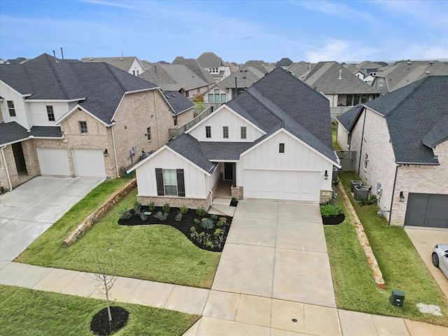 view of front of house featuring a front yard and central air condition unit