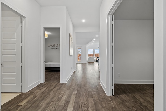 hallway with dark wood-type flooring