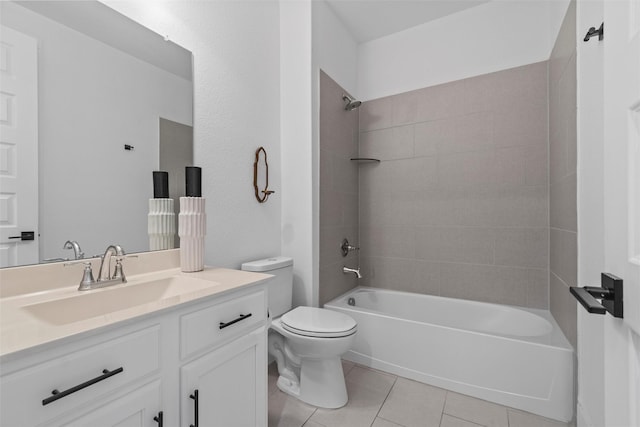 full bathroom with tiled shower / bath combo, vanity, tile patterned floors, and toilet