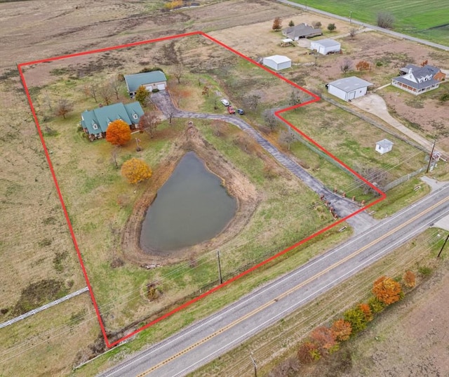 birds eye view of property featuring a rural view