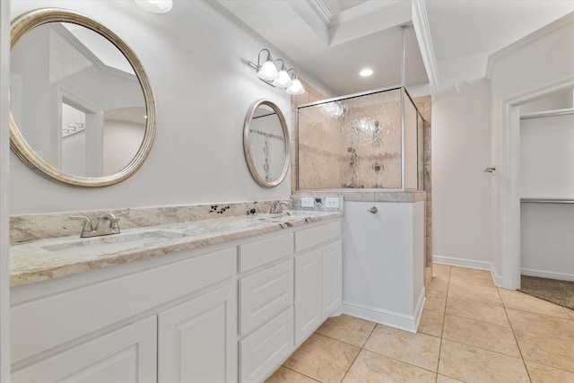 bathroom with double vanity, tile patterned floors, a sink, and tiled shower