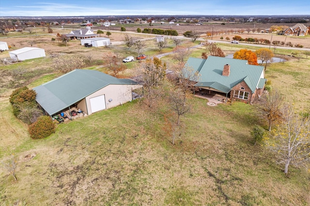 birds eye view of property with a rural view