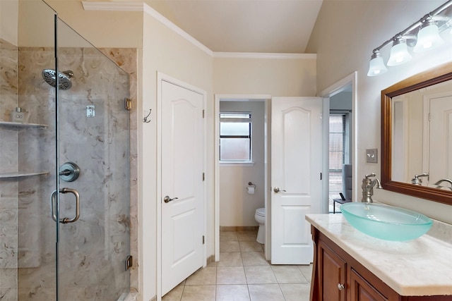 bathroom with an enclosed shower, ornamental molding, vanity, tile patterned flooring, and toilet