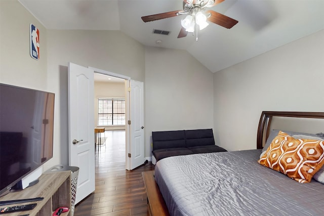 bedroom featuring ceiling fan, lofted ceiling, and dark wood-type flooring