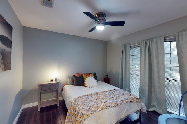 bedroom featuring ceiling fan and dark wood-type flooring