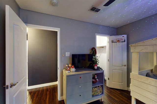 bedroom featuring ceiling fan and dark hardwood / wood-style flooring