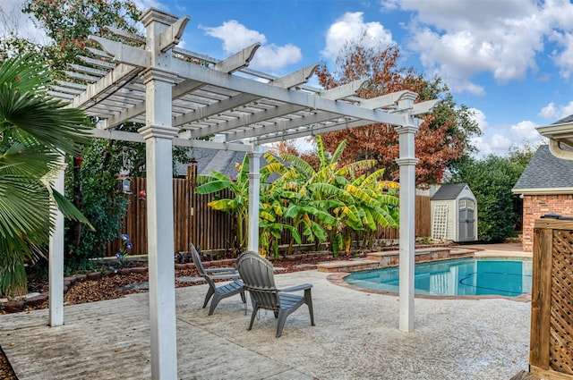 view of pool with a shed, a pergola, and a patio